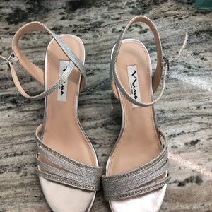 Worn one time.  Very comfortable. 2.5 inch heel. Nina Nelena Platino Silver.